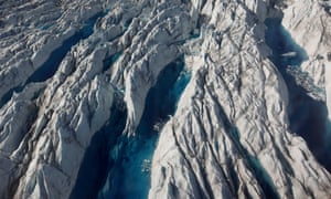 In this July 19, 2011 photo, pools of melted ice form atop Jakobshavn Glacier, near the edge of the vast Greenland ice sheet.