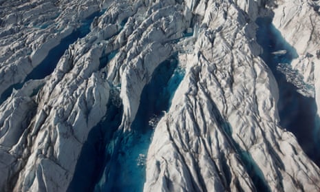 In this July 19, 2011 photo, pools of melted ice form atop Jakobshavn Glacier, near the edge of the vast Greenland ice sheet.