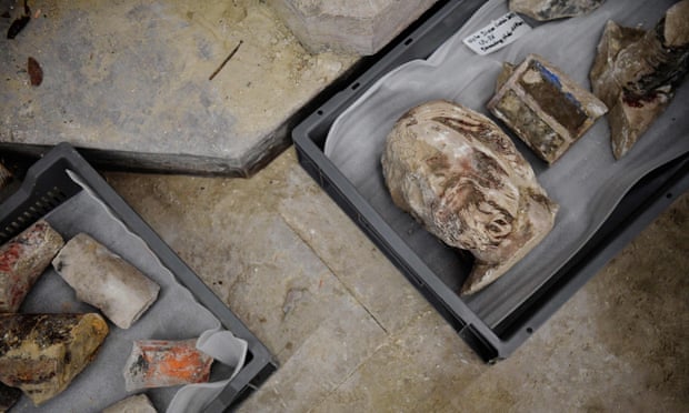 A photo shows antique objects found by archaeologists in the floor of Notre Dame cathedral.