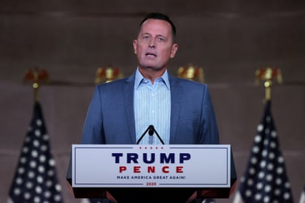 Richard Grenell speaks at a Trump-Pence podium flanked by American flags