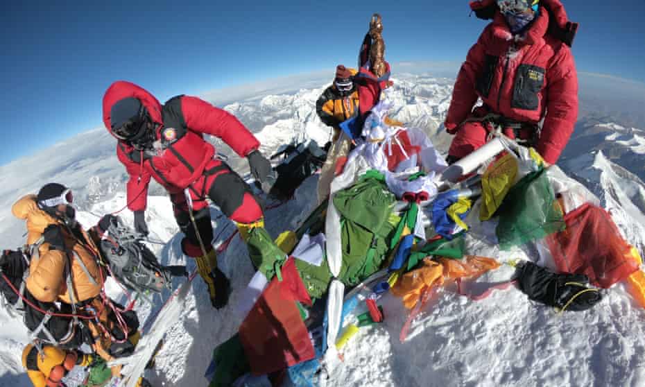 Mountaineers and sherpas gather at the summit of Mount Everest in May 2018