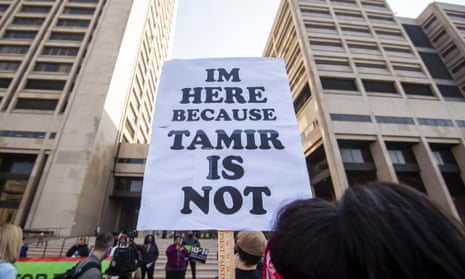 A supporter holds a sign on 9 November 2021 in Cleveland during a rally for Tamir Rice, who was killed by Timothy Loehmann in 2014.