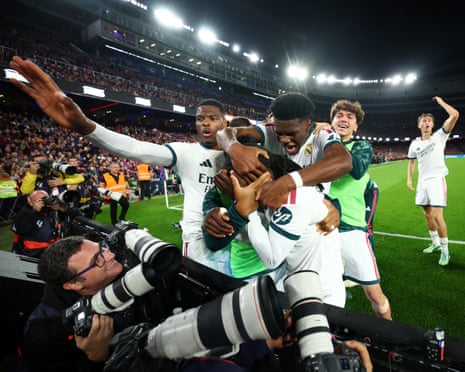 Real MadridâÂÂs players converge after Kylian MbappéâÂÂs late winner at the Camp Nou.