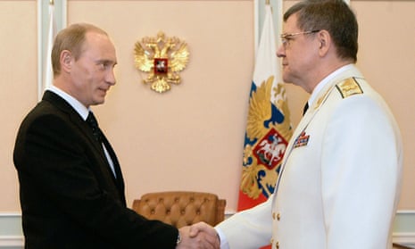Russian President Vladimir Putin shakes hands with general prosecutor Yuri Chaika.