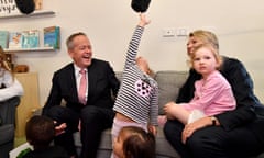 Bill Shorten as a girl plays with a television boom microphone at the Goodstart early learning childcare centre in Nollamara, Perth, on Monday