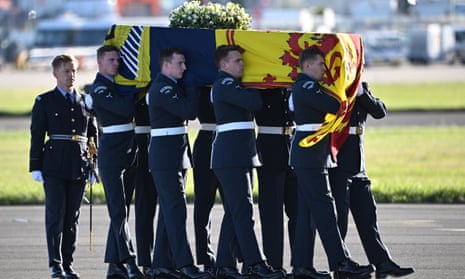 Pallbearers from the Queen’s Colour Squadron of the Royal Air Force (RAF) carry the coffin of Queen Elizabeth II, draped in the Royal Standard of Scotland, into a RAF C17 aircraft at Edinburgh airport.