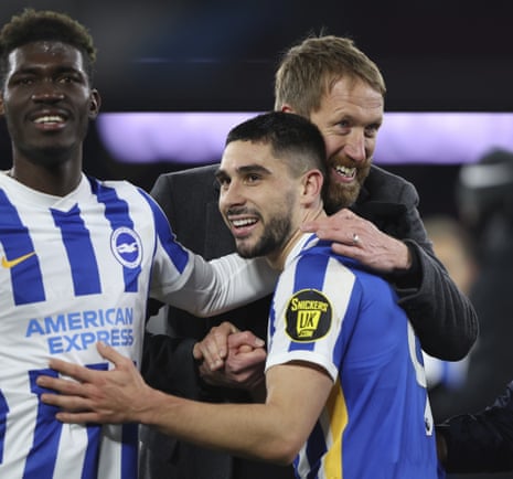 Brighton’s manager Graham Potter (right) celebrates with goalscorer Neal Maupay and Yves Bissouma (right) celebrate after snatching a point.