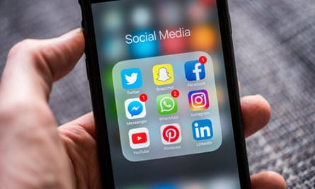 Social media app icons with notifications displayed on Apple iPhone