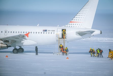 Expeditioners boarding the A319 at Wilkins Aerodrome, near Casey research station, for the flight home to Hobart.