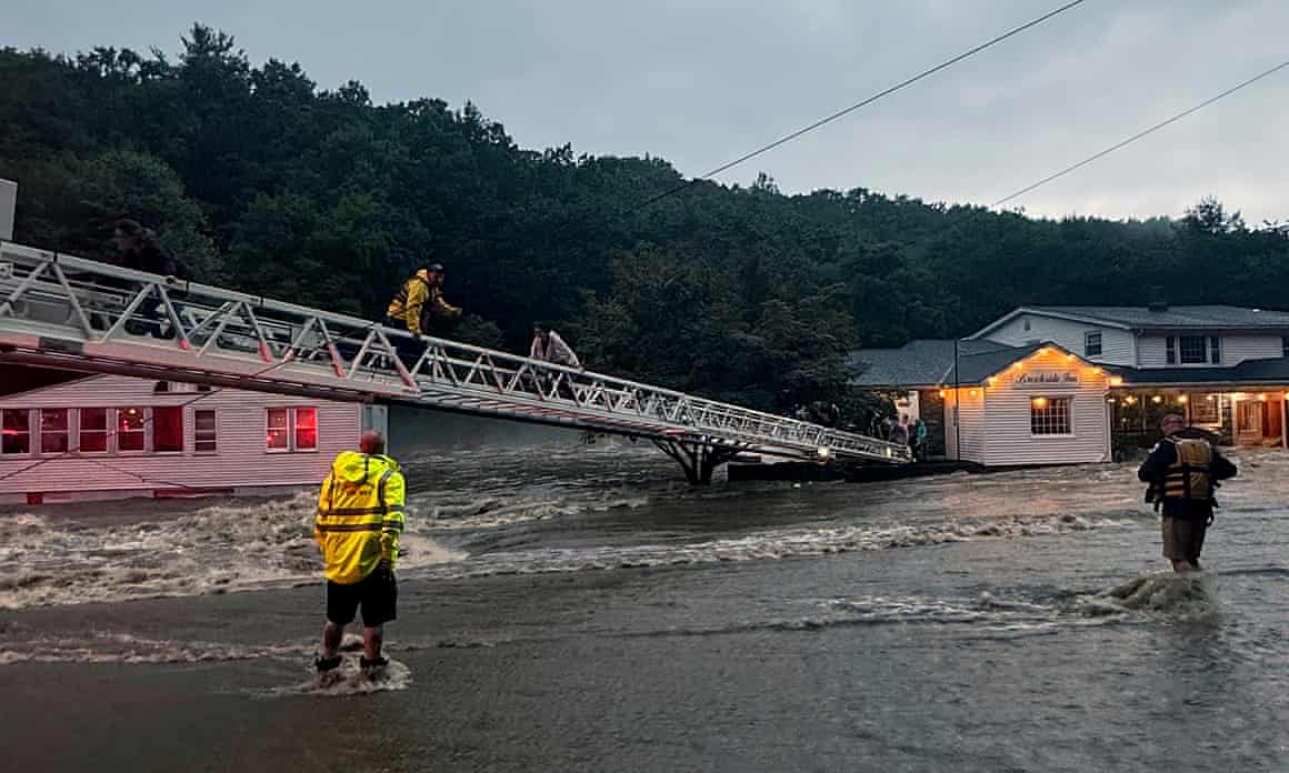 Rescuers try to help people at the Brookside Inn in Oxford, Connecticut.