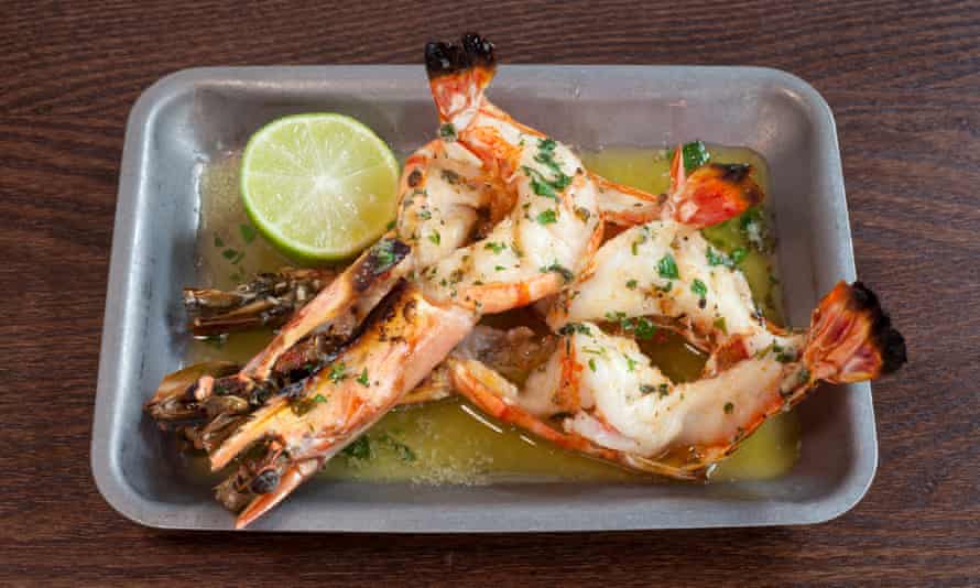 “Split and grilled with precision”: king prawns.