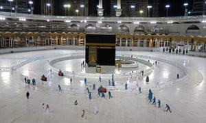 Sanitation workers disinfecting the area around the Kaaba in Mecca’s Grand Mosque, on the first day of the Islamic holy month of Ramadan, amid unprecedented bans on family gatherings and mass prayers due to the coronavirus pandemic.
