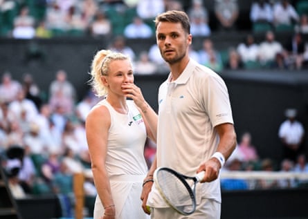 Netherlands’ Sem Verbeek and Czech Republic’s Katerina Siniakova talk on court at Wimbledon