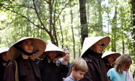 Thich Nhat Hahn leading people in a walking meditation in 2013