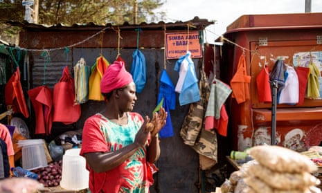 Ruth Kwamboka sells snacks in compostable bags to shoppers at her stall in Kawangware, Nairobi.