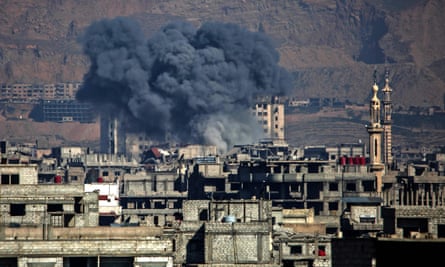 Smoke billows following an airstrike in the Syrian rebel-held town of Arbin