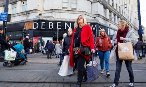 Shoppers on Black Friday outside Debenhams department store in Manchester