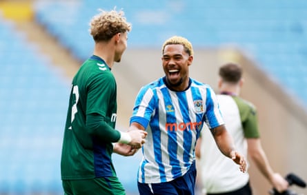 Milan van Ewijk shares a joke with Carl Rushworth in a friendly