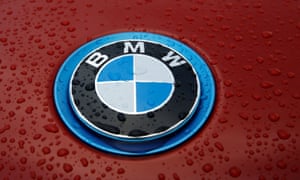 Raindrops cover the bonnet of a BMW car