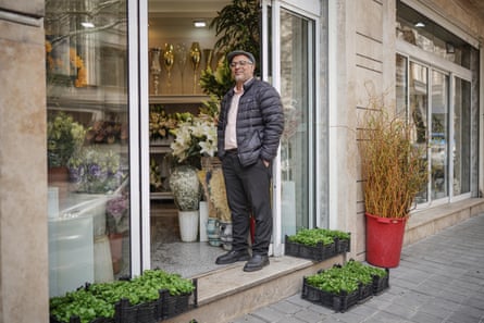 Hassan stands in the doorway