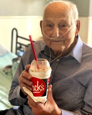 In this photo provided by Holly Wooten McDonald, World War II veteran and COVID-19 survivor Major Wooten holds a celebratory milkshake on his 104th birthday on Thursday, 3 December, 2020, in Madison, Alabama.