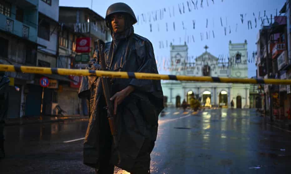 A Sri Lankan soldier stands guard in the rain at St Anthony’s shrine in Colombo. Security remains high amid warning further attacks were possible.