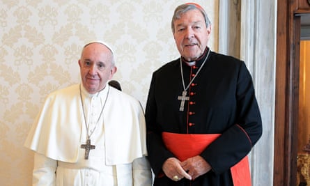Pope Francis and George Pell standing next to each other in their religious robes
