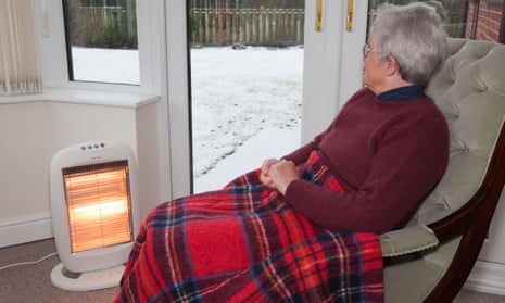 An older person next to an electric fire