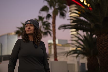 a woman poses for a photograph