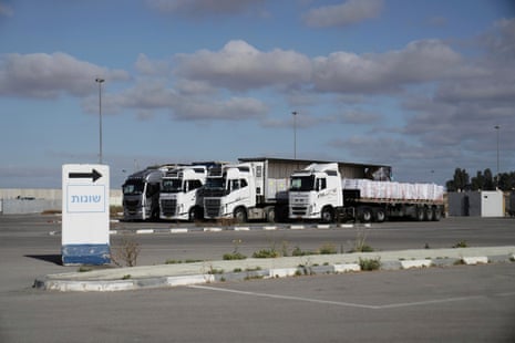 Trucks load with humanitarian aid for the Gaza Strip are seen at the Kerem Shalom crossing in southern Israel.