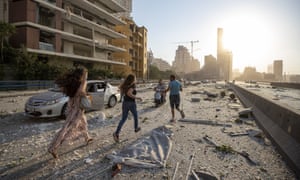 People run in the aftermath of a massive explosion in Beirut, Lebanon, Tuesday, 4 August 2020.