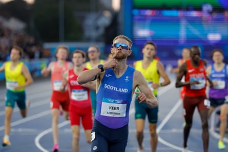 Josh Kerr celebrates as he crosses the finish line to win the men’s one mile final at the Commonwealth Games in Glasgow.