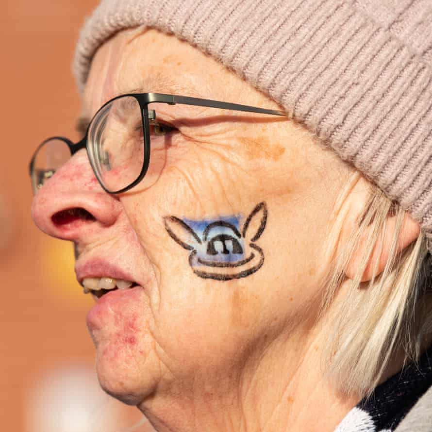 A Manchester City fan with face paint.
