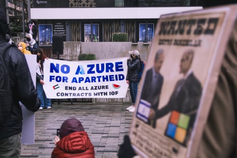 people hold a banner that reads ‘No Azure for Apartheid – end all Azure contracts with IOF’