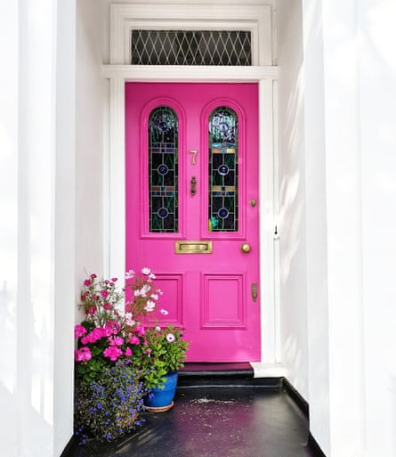 Think pink: a nice bright front door with flowers.