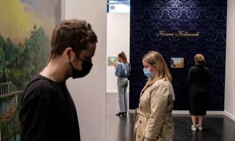 People look at work displayed at the Frieze New York art fair in May.