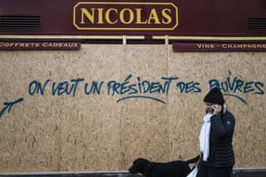 Graffiti on a wine shop reads ‘we want a president for the poor’