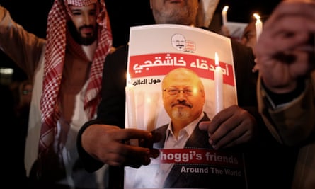 A protester, left, wears a mask depicting Mohammad bin Salman during a demonstration calling for justice for Jamal Khashoggi in Istanbul