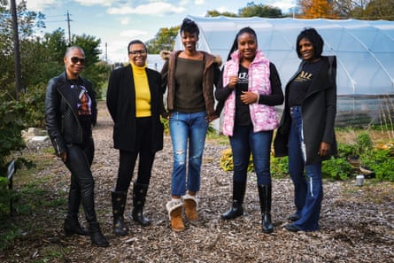 Zen Adams, Sheena Diane, Shallanna Agbomanyi and Lori Middleton, administrators of Rid-All standing in front of greenhouses at Rid-All in Cleveland, Ohio.
