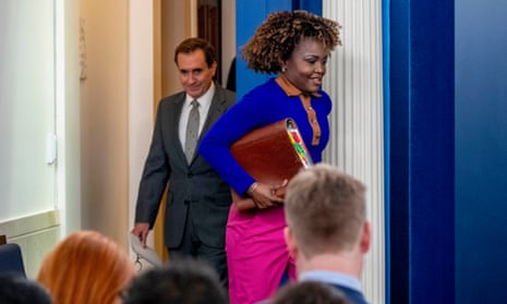 White House press secretary Karine Jean-Pierre, right, and National Security Council spokesman John Kirby arrive for a press briefing at the White House.