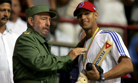Yulieski Gurriel, shown receiving a baseball bat from Fidel Castro in March 2006 file, has defected with his brother Lourdes while on tour. 