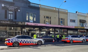 Police check cars heading into the city