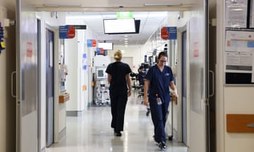 Nurses walking down a hospital corridor 