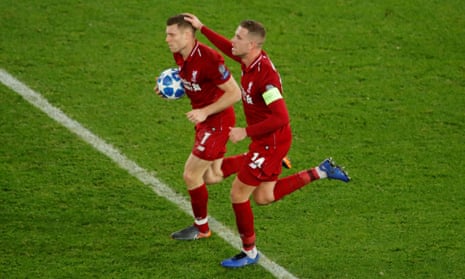 Liverpool’s James Milner celebrates scoring their first goal with Jordan Henderson