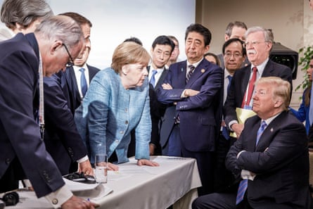 The German chancellor Angela Merkel meets US president Donald Trump during the G7 summit in 2018. Also pictured (l-r) Larry Kudlow, Theresa May, Emmanuel Macron, Yasutoshi Nishimura, Shinzo Abe, Kazuyuki Yamazaki and John Bolton.