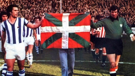 The captains Inaxio Kortabarría of Real Sociedad and José Ángel Iribar carry the still-illegal Basque flag before the derby in December 1976