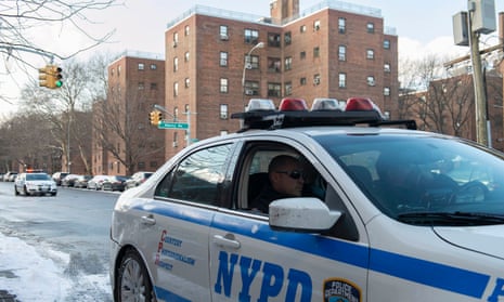 A NYPD vehicle patrols near the Marcy Houses public housing development in the Brooklyn borough of New York.