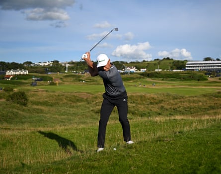 Li Haotong of China plays out of the rough on the 17th hole during the third day of the Open