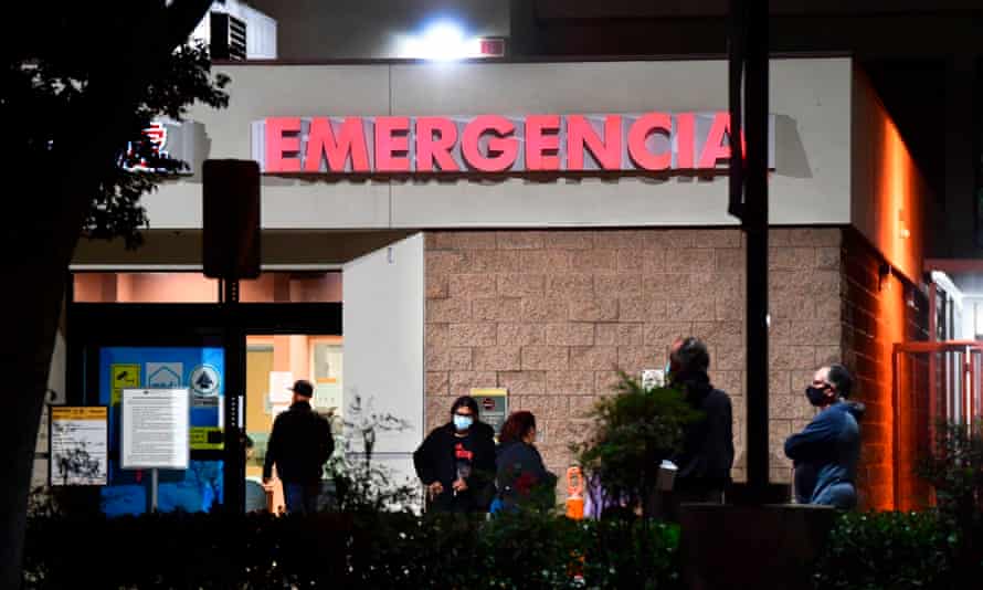 People wait outside the emergency room of the Garfield medical center in Monterey Park, California.