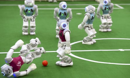 A robot falls in a soccer match at RoboCup 2015, in China.
